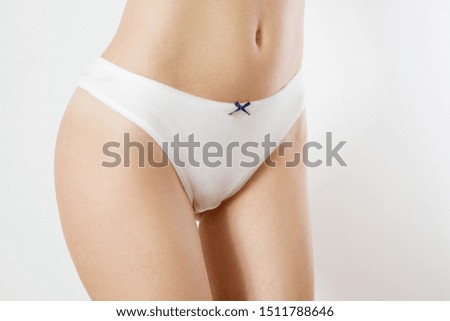 Template Blank Close up White Woman Panties isolated on gray background. Cropped image. Flat Belly and nutrition concept. Female health. Pain periods and cycle problems. Front view and copy space