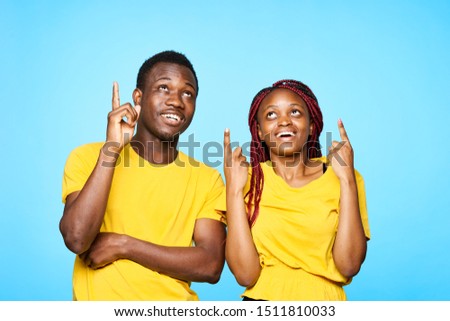Young African American people gesturing with their hands on a blue isolated background index finger emotions