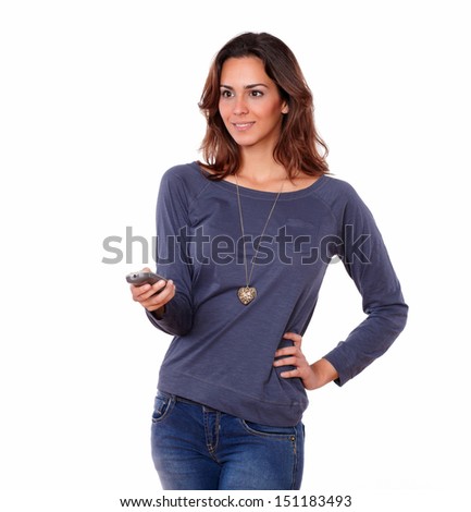 Portrait of a gorgeous female pointing the remote control on white background - copyspace