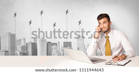 Announcer sitting at desk presenting the city energy consumption