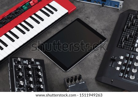 Empty tablet and electronic music instruments
