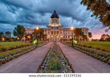 A storm rolls in at dawn at the South Dakota State Capitol building in Pierre, South Dakota Royalty-Free Stock Photo #151199336