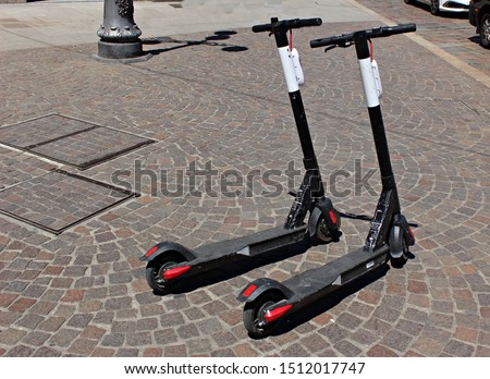 Italy: Electric scooters for hire.