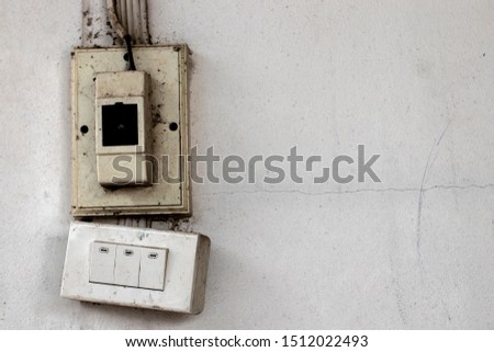 Damage , old Power plug and electric switch on the wall