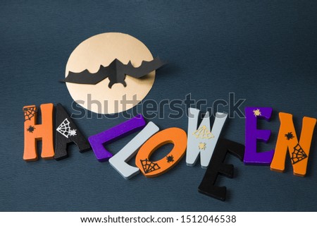 Happy Halloween wooden letters with pumpkins, spiders and other decorations