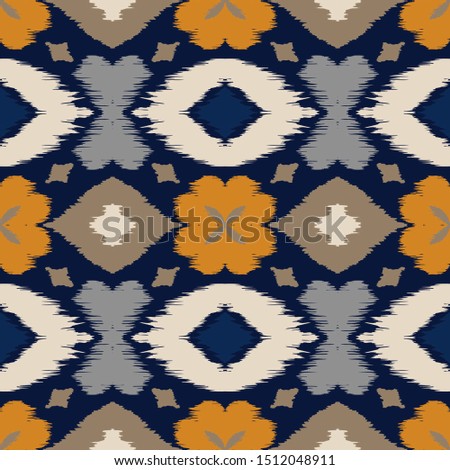 Ikat geometric folklore ornament with diamonds and flowers. African rug. Tribal ethnic vector texture. Seamless pattern in Aztec style. Folk embroidery. Indian batik. Mexican decor.