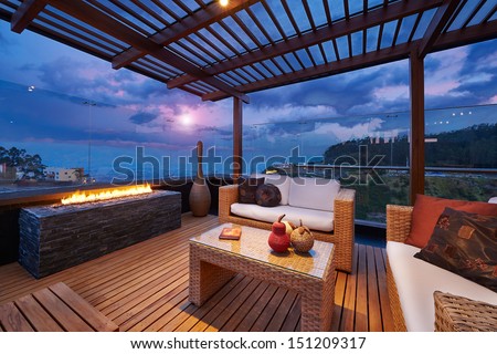 Interior design: Beautiful modern terrace lounge with pergola at sunset Royalty-Free Stock Photo #151209317