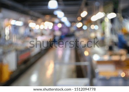 the blurred fish market environment with light bokeh