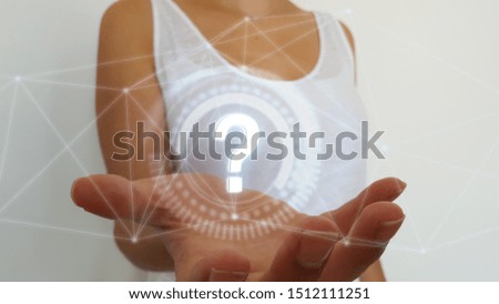 Woman on blurred background using digital question mark
