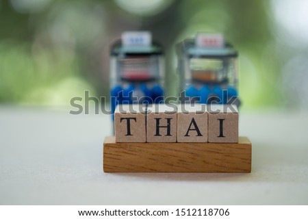 Word letters alphabet of Thai with public service car background