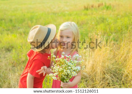 Kids play in autumn park. Love. Child playing Happy childhood. Little angels in love. Festive Art Greeting Card. Summer portrait of happy cute children