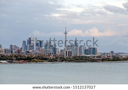 Skyline of Toronto over Ontario Lake at sunset