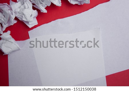 Paper with space for letters on a red background.
torn and crumpled paper,