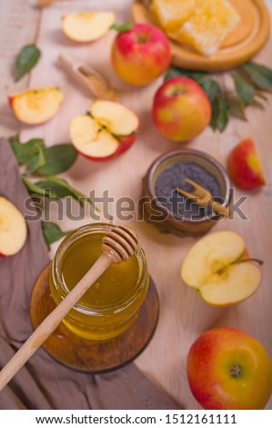 Jewish holiday Rosh Hashana background with apples, honey on blackboard. View from above. Flat lay