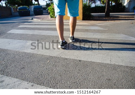 Pedestrian crossing walkway near the sports park. Person crossing the street. Pedestrian safety in cities. Marbella Andalucia Spain