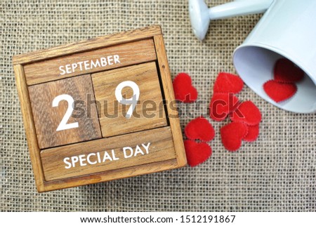Wooden calendar on September 29 and hearts.World heart day concept. 