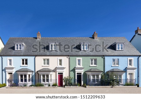 Row of colorful and modern english houses  Royalty-Free Stock Photo #1512209633