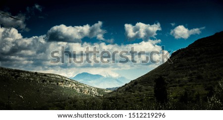 View of hilly landscape against sky