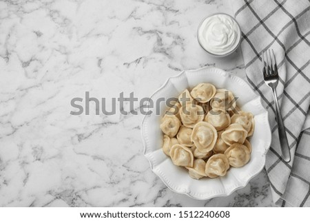 Flat lay composition with tasty dumplings on marble table, flat lay. Space for text
