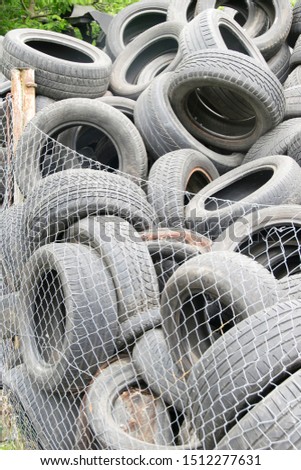 view of old tires. Many car and truck tires on dump site. Ecology . Waste tires, environmental pollution