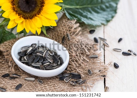 Some Sunflower Seeds on wooden background