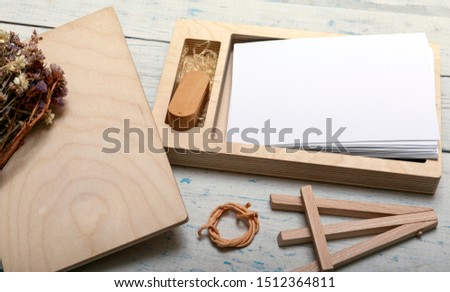 Decorative wooden box for wedding or newborn photo with memory sticks. Ecological friendly package for wrapping. Empty photo balnk for text or other. Rustic vintage styl with copyspce.