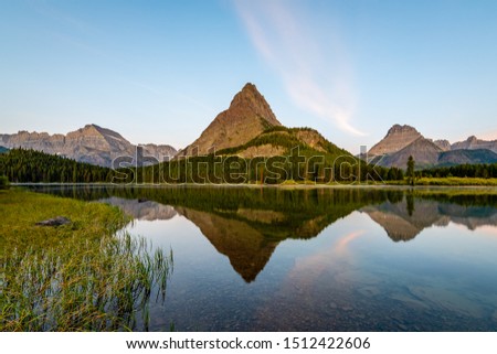 Sunrise Reflections of Swiftcurrent Lake from Many Glacier