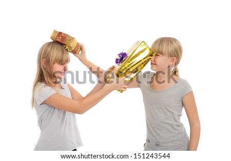 Sisters beating each other with gift boxes