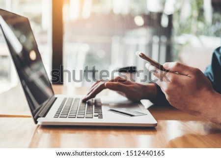 Online banking businessman using Laptop with credit card Shopping online Fintech and Blockchain concept