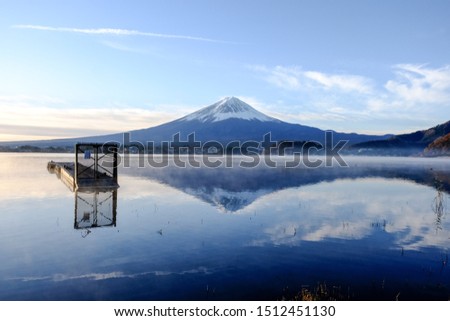 Scenic view of Mount Fuji  with clear blue sky background, and front a reflection in water lake.