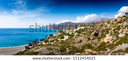 Scenic view of sea and mountain against cloudy sky, Crete, Greece