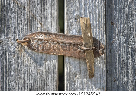 Padlock on a old wooden door