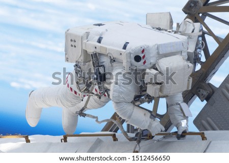 Tied astronaut in outer space on a space station. Elements of this image were furnished by NASA