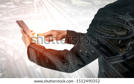 Double Exposure Image of Business Communication Network Technology Concept - Business people using smartphone or mobile phone device on modern cityscape background.
