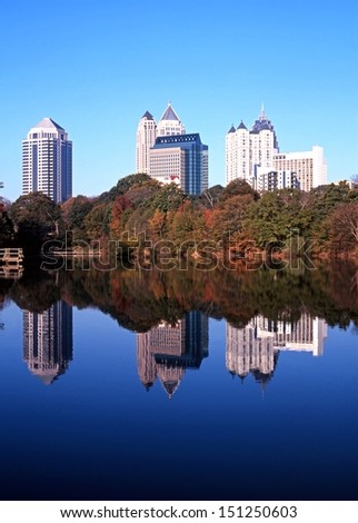 Reflections of skyscrapers in Piedmont Lake, Piedmont Park, Atlanta, Gerogia, USA.