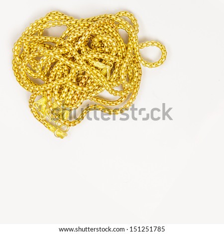 Gold necklace on white background