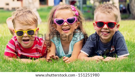 Smiling kids at the garden Royalty-Free Stock Photo #151251980