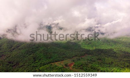 High angle viewpoint over rainforest mountains in Thailand.
