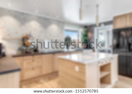 blurred image of modern kitchen interior for background
