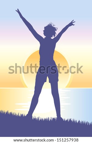 Silhouette of young woman meeting the sunrise on the hill