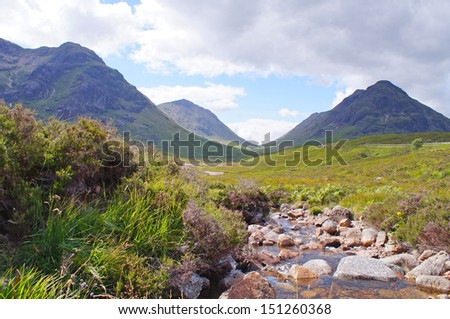 Panoramic view of mountains in the background along The West Highland Way is a  long distance footpath in Scotland Royalty-Free Stock Photo #151260368