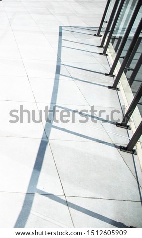 modern office tile floor and shadow from fence vertical perspective picture with empty copy space for text 