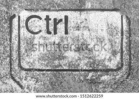 Grunge graffiti depicting the Ctrl key. Ideal for creative backgrounds computer-based concepts. IT piracy. Deep web. Hackers