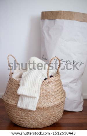 basket of woolen clothes. autumn and winter concept