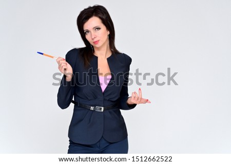 Portrait of a brunette manager woman in a business suit on a white background with a folder in her hands. Great makeup and beautiful hair. Standing right in front of the camera in various poses.
