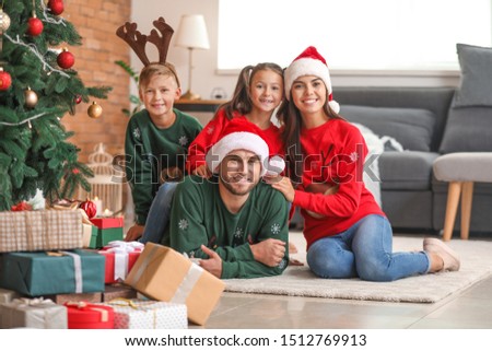 Happy family at home on Christmas eve