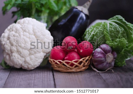 Different vegetables on blue background and wooden surface, rustic. Selective focus
