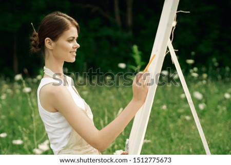 beautiful model easel woman with brush