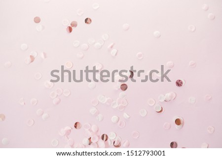 Creative layout made of christmas decor. Festive pastel background. Christmas stars and shining glitter, confetti on pastel background. Flat lay, top view.
