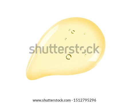Serum texture. Face oil, liquid gel drop isolated on white background. Yellow colored cosmetic skincare product with bubbles swatch Royalty-Free Stock Photo #1512795296